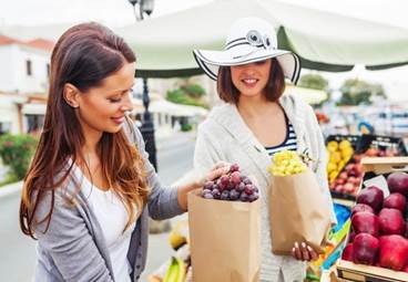 two women shopping at the farmer's market